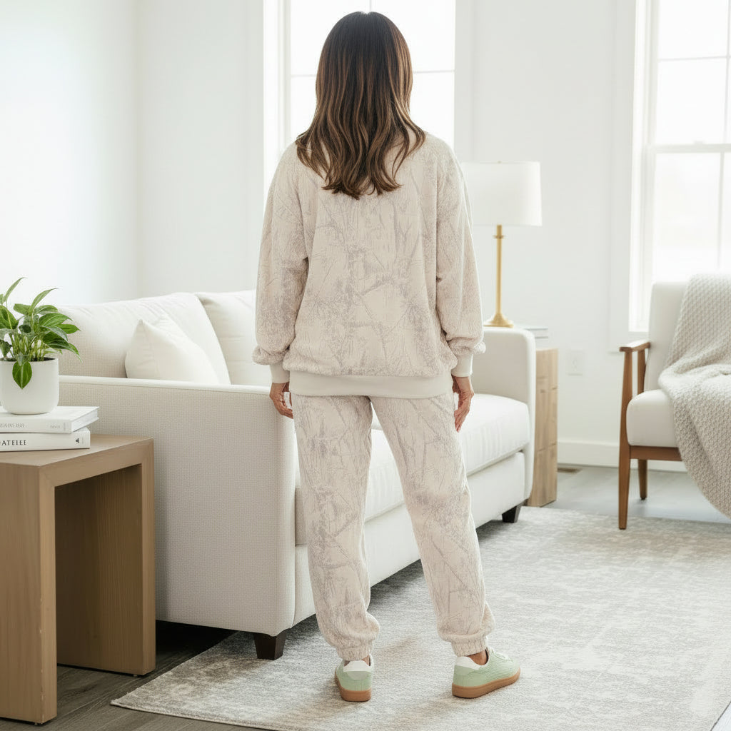 Model wearing the SOFT TERRAIN 2 pc Lounge Set in soft gray and cream camo print, showcasing a relaxed style.