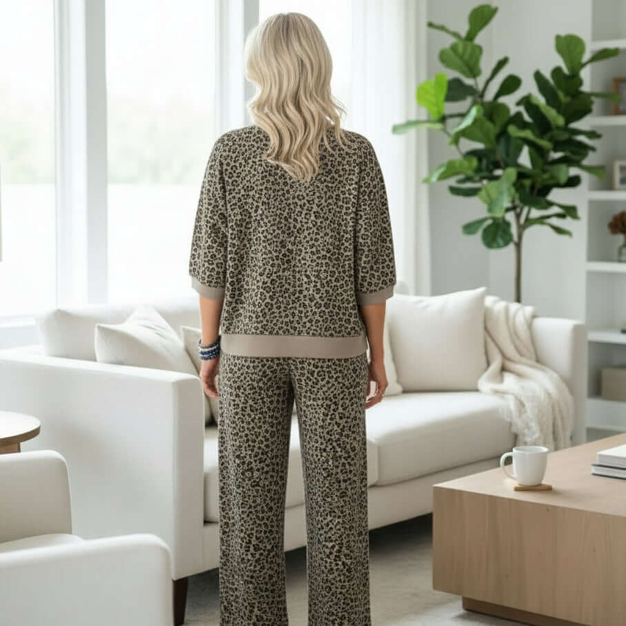 Woman wearing GROUNDED GRACE 2 pc Lounge Set in khaki jacquard leopard print, seen from behind in a modern living room.