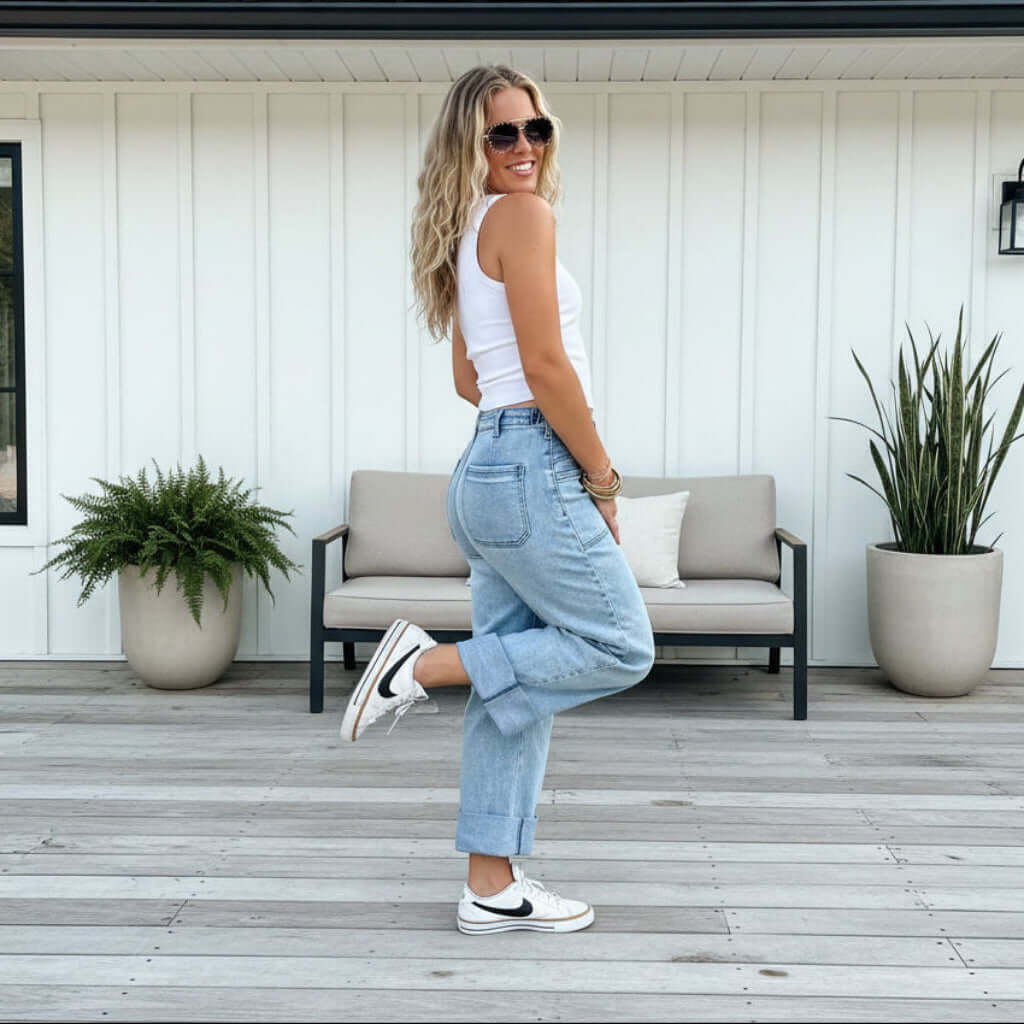 Model showcasing BLAKELY CLOVER FRONT POCKET JEANS, standing in casual attire with a stylish pose.