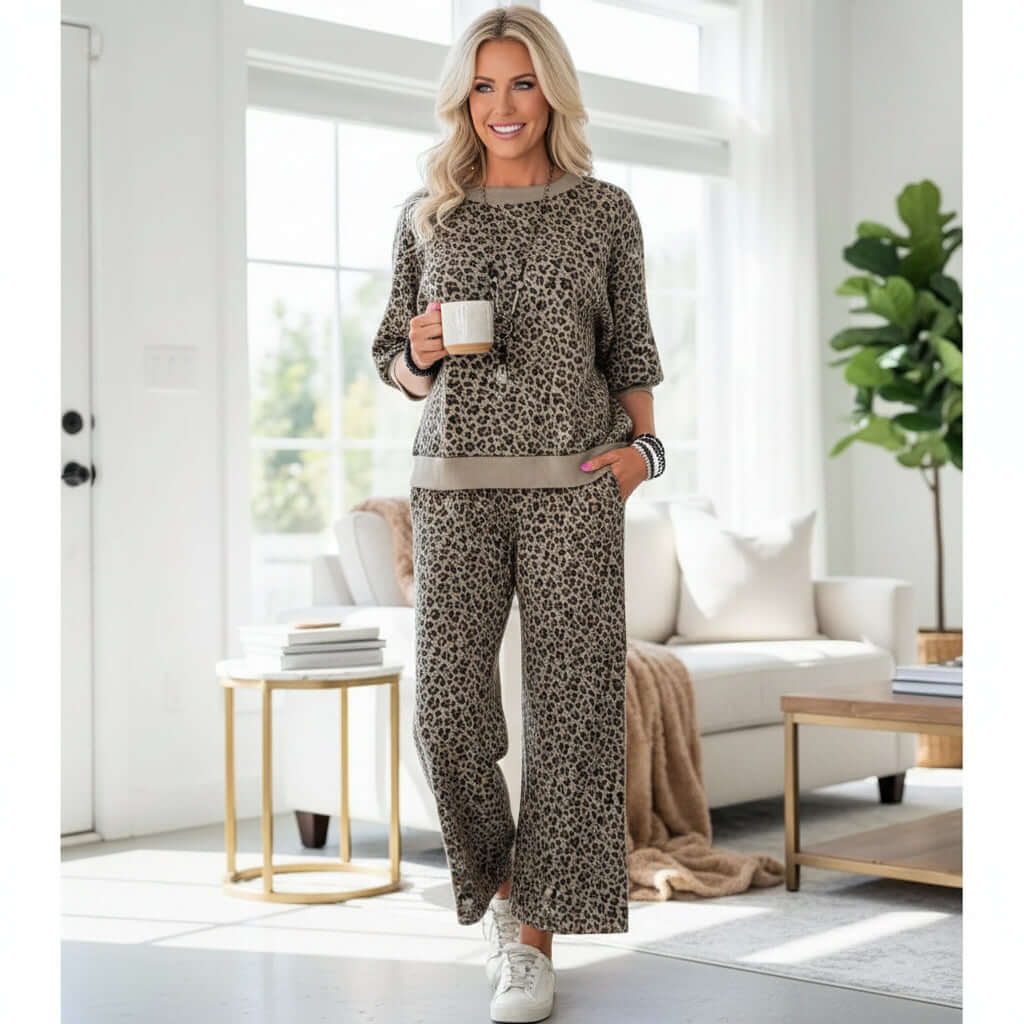GROUNDED GRACE 2 pc Lounge Set worn by a model in a cozy living room, showcasing chic leopard print and relaxed style.