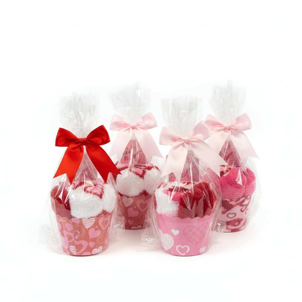 Too Cute to Eat Valentine Sock Cupcakes in gift-wrapped cupcake cups with bows and cellophane.