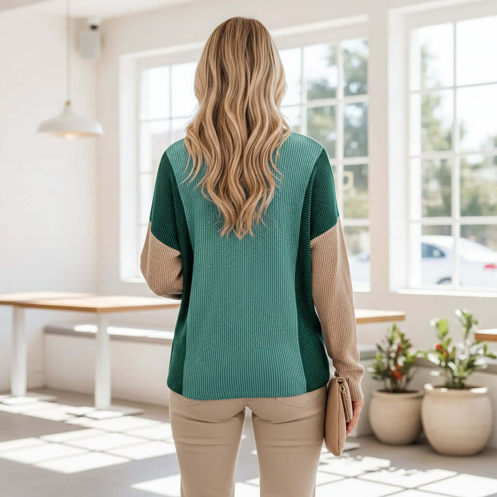 Back view of a woman wearing the EVERYDAY BALANCE TOP, showcasing its jade corded colorblock design.