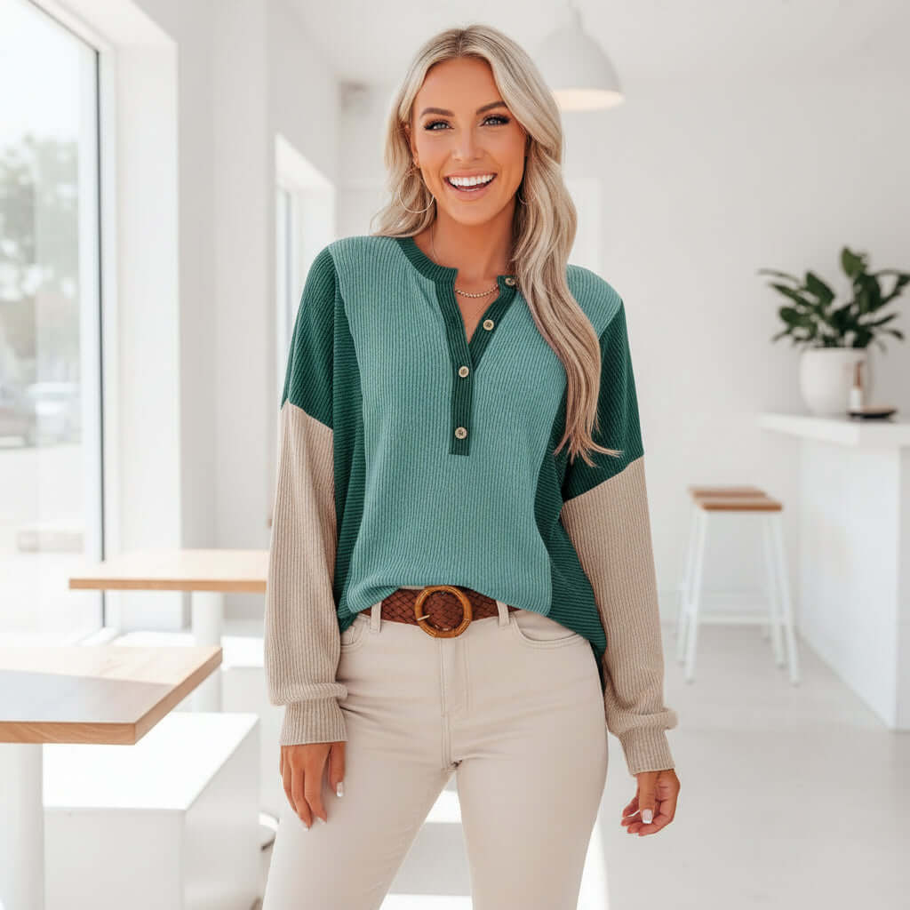 Model wearing the EVERYDAY BALANCE TOP in jade colorblock with an oversized fit and half-placket neckline.