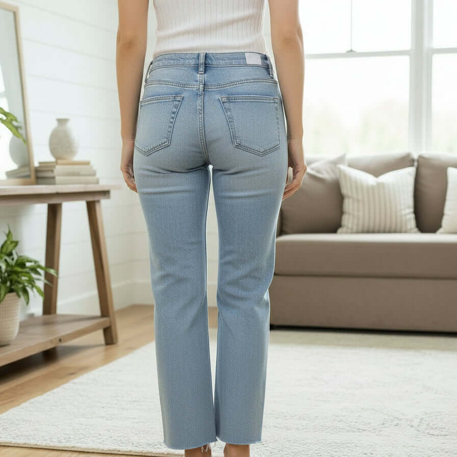 Back view of a model wearing ZELDA WIDE LEG JEANS by Vervet, showcasing the high-rise fit and cropped silhouette.