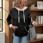 Modern Edge Hoodie featuring a chic black and cream color block design, perfect for casual outings and cozy wear.