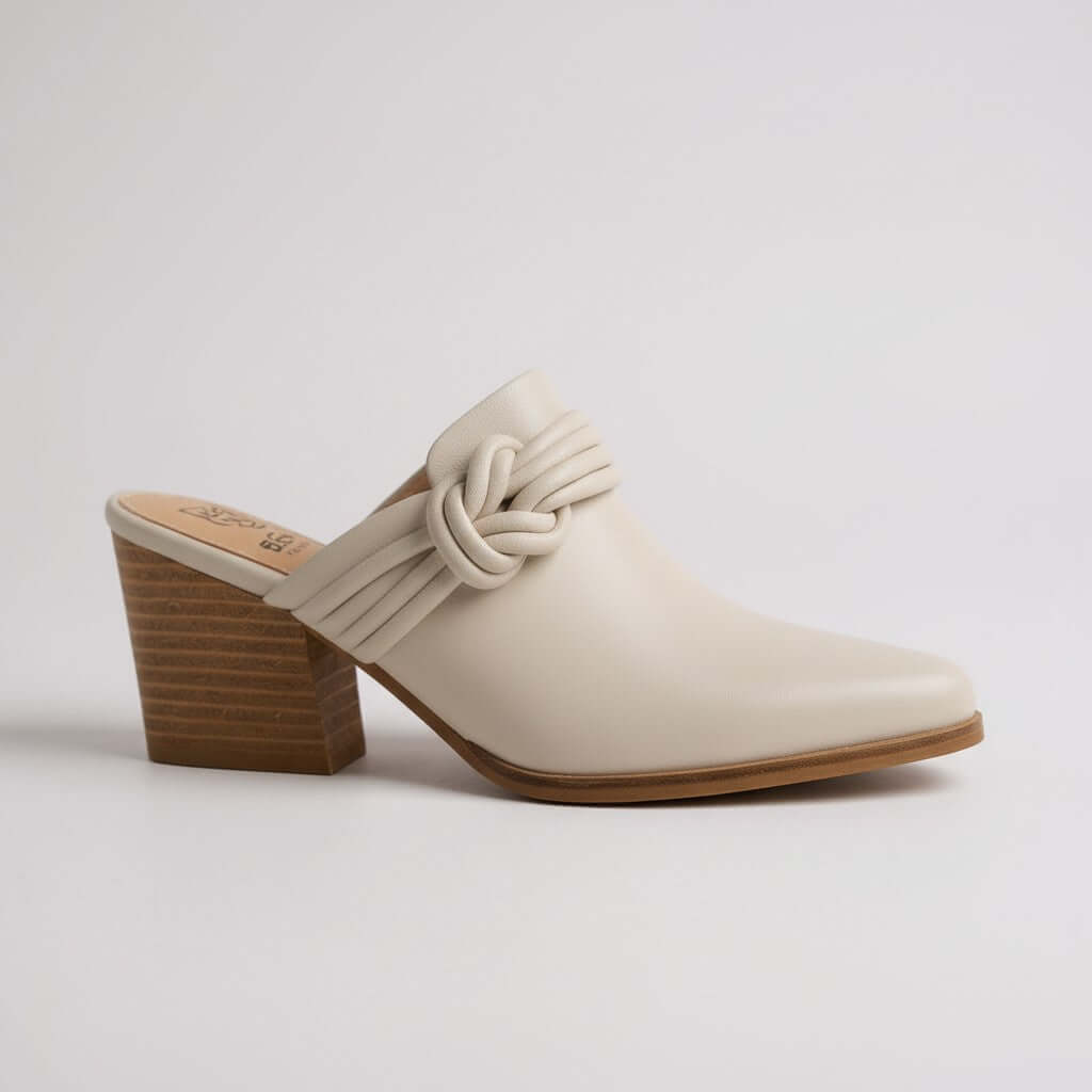 HAZEL SLIP-ON MULES featuring a chic knotted strap design and a stylish pointed-toe silhouette.