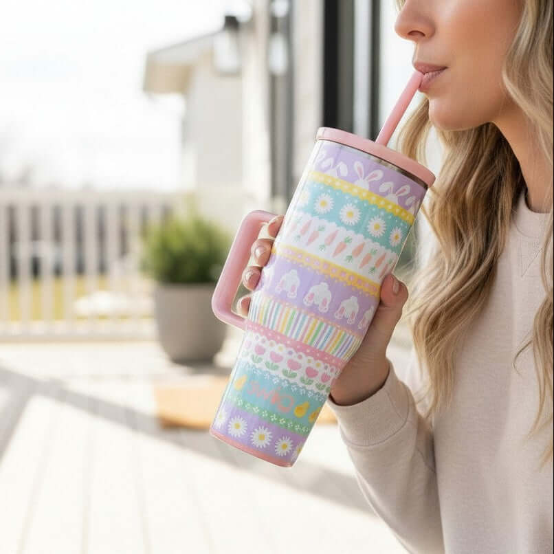 BUNNY TRAIL 40 OZ MEGA MUG - Swig Life in pastel colors with a comfort-grip handle being enjoyed outdoors.