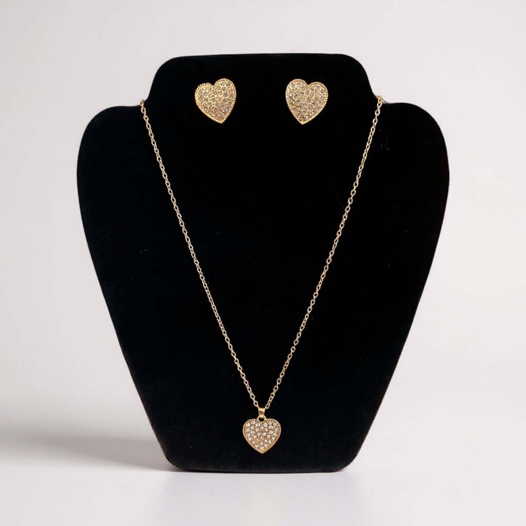 LOVE STORY Earrings and Necklace Set (gold) featuring heart-shaped design with sparkle on display.