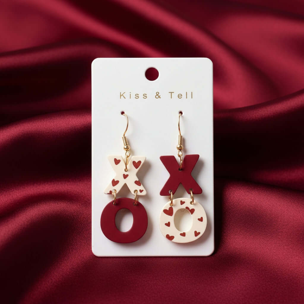 KISS & TELL EARRINGS designed with XO heart print and lightweight ceramic-style acrylic for playful Valentine vibes.