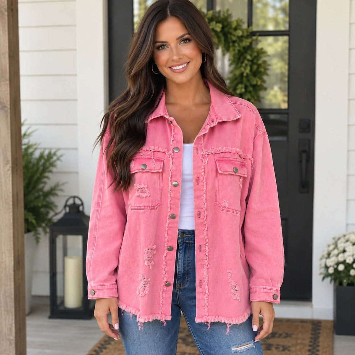 SWEET TALK JACKET in taffy pink worn by a woman, featuring distressed details and relaxed fit.