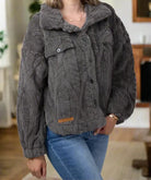 Charcoal gray Simply Soft Sherpa Jacket by Simply Southern with button front and cable knit design, worn by a model indoors.