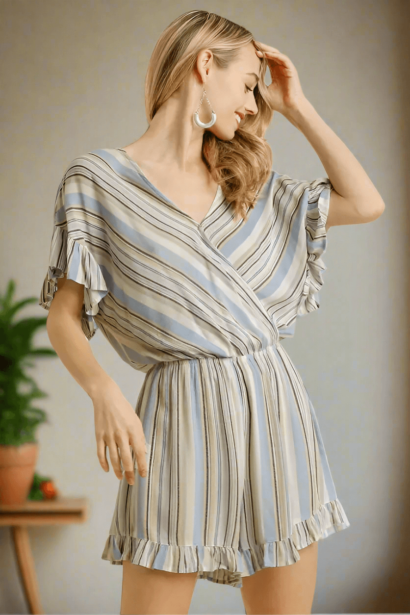 Shoreline Sass Romper in sky blue stripes by Umgee, featuring lightweight fabric and a flattering drape.