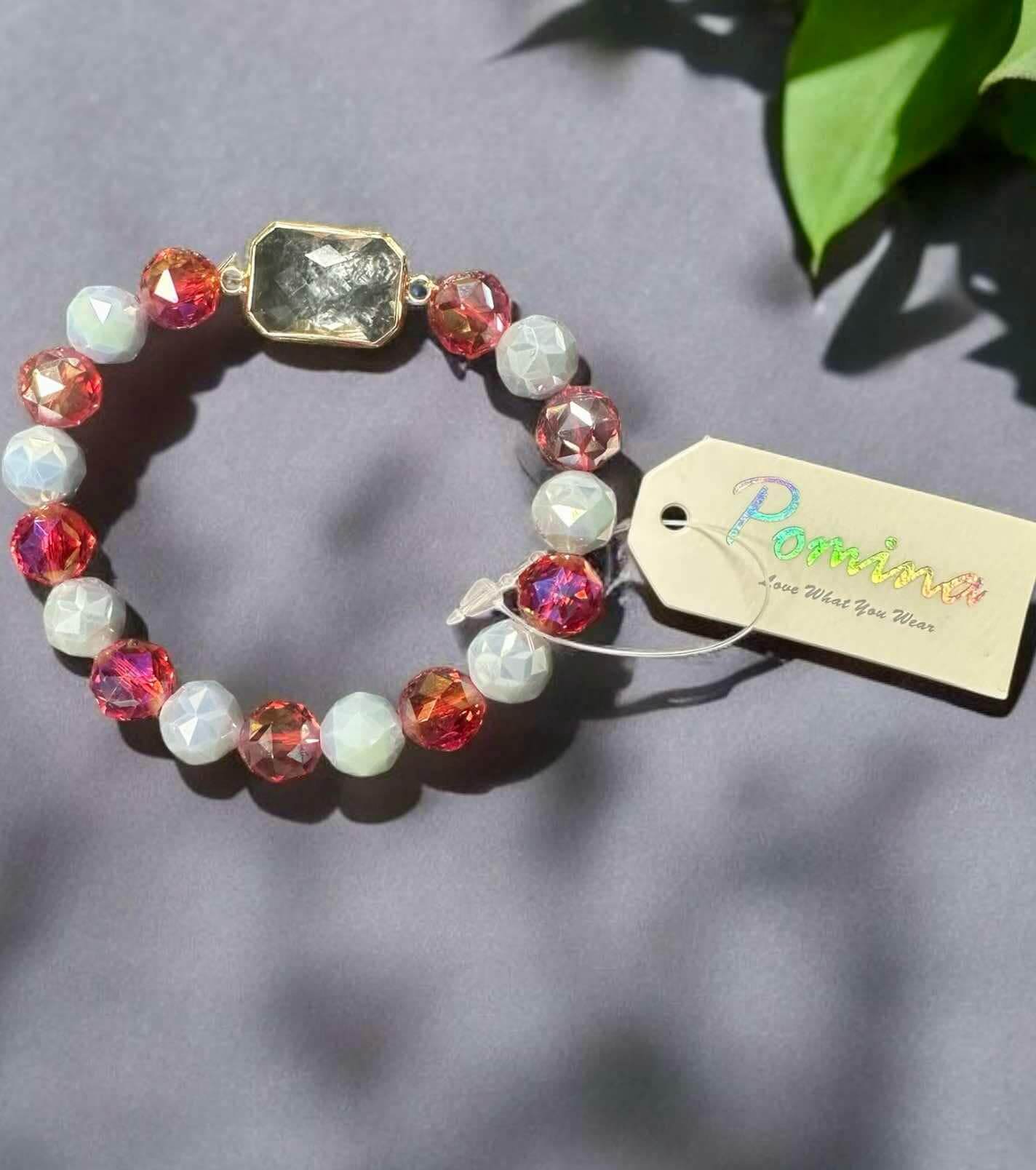 Vibrant Level Up - Pomina Bracelet featuring glass gemstone and colorful beaded design on gray background.