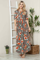 Women's floral shirred maxi dress with short sleeves, flowy silhouette; model wears size S.