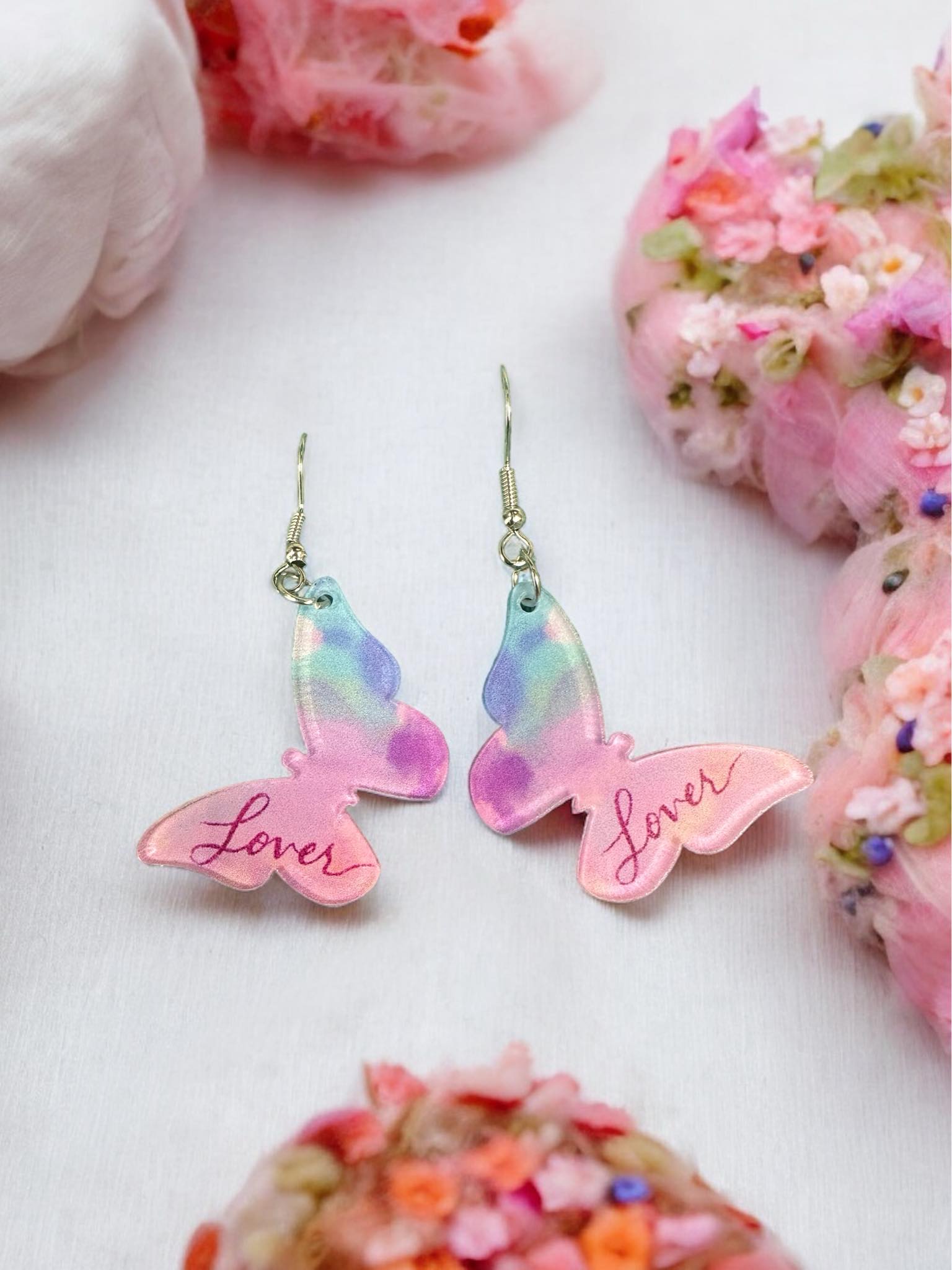 LOVER ERA BUTTERFLY earrings with pastel colors, measuring 1.75" long, featuring acrylic design and delicate butterfly shape.