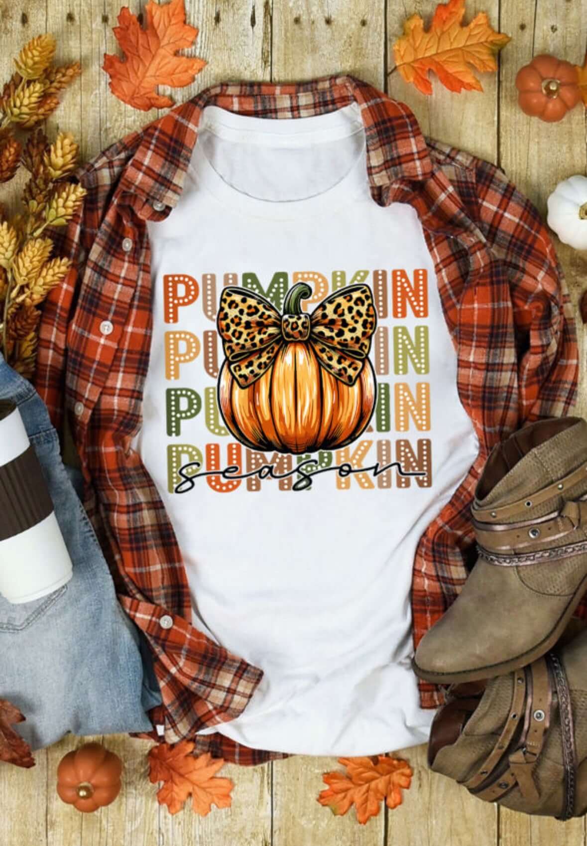 PUMPKIN PARTY TEE featuring a colorful pumpkin design with a bow, perfect for fall celebrations.