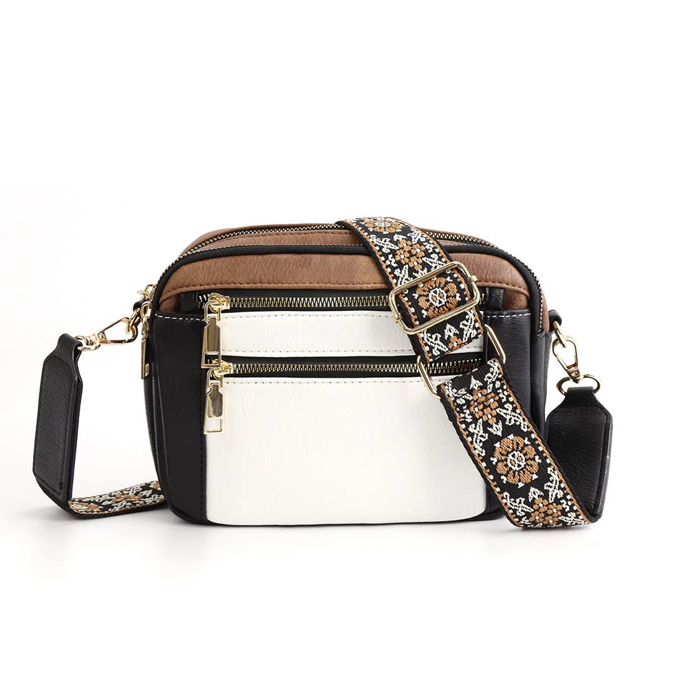 NATASHA Crossbody Bag with woven guitar strap, featuring black, white, and brown design, perfect for style and comfort.