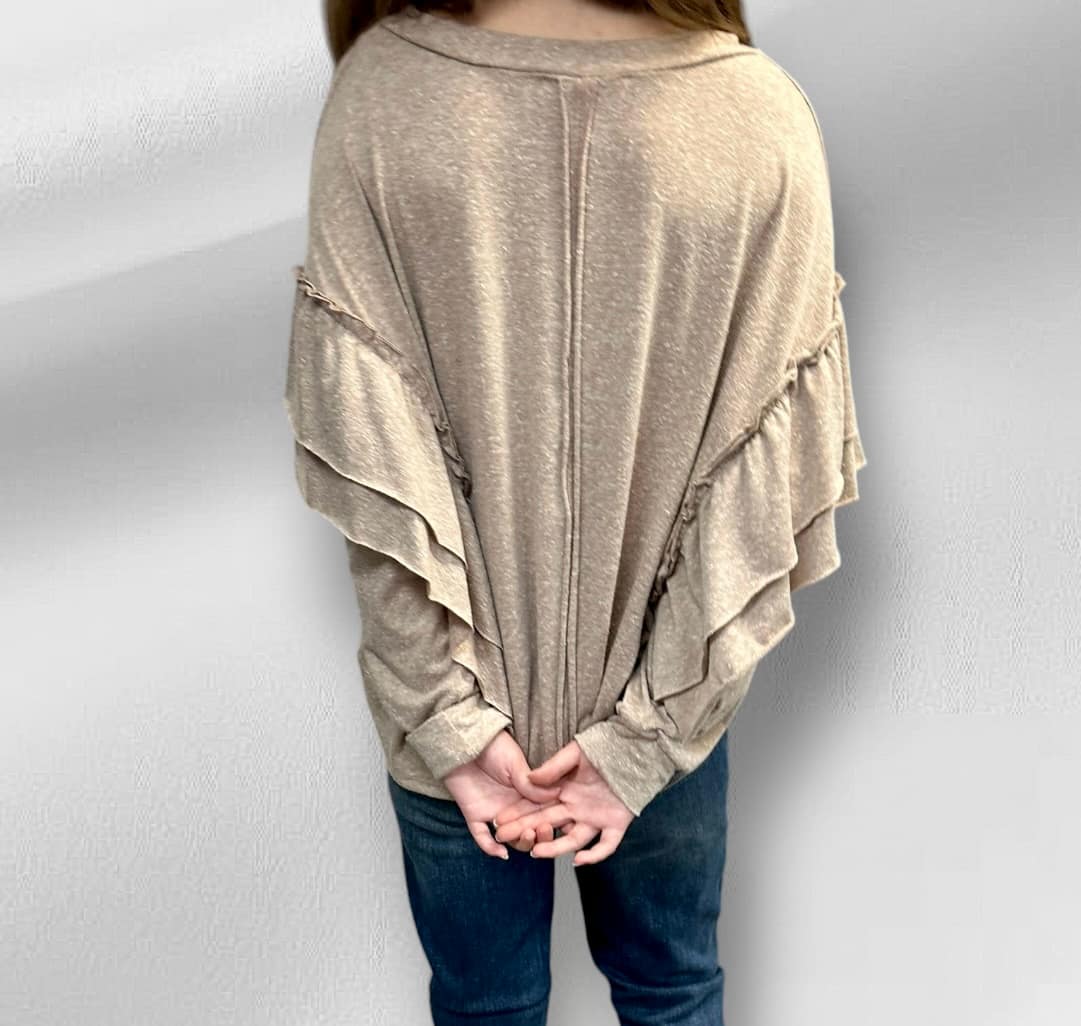 Neutral tan Soft Landing Top with double ruffle detail, mineral wash color, and exposed back seam, worn by model in jeans.