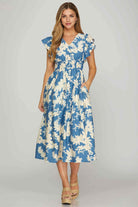 Lakeside Serenade Dress by She + Sky in blue and cream floral print, perfect for summer outings and brunch dates.