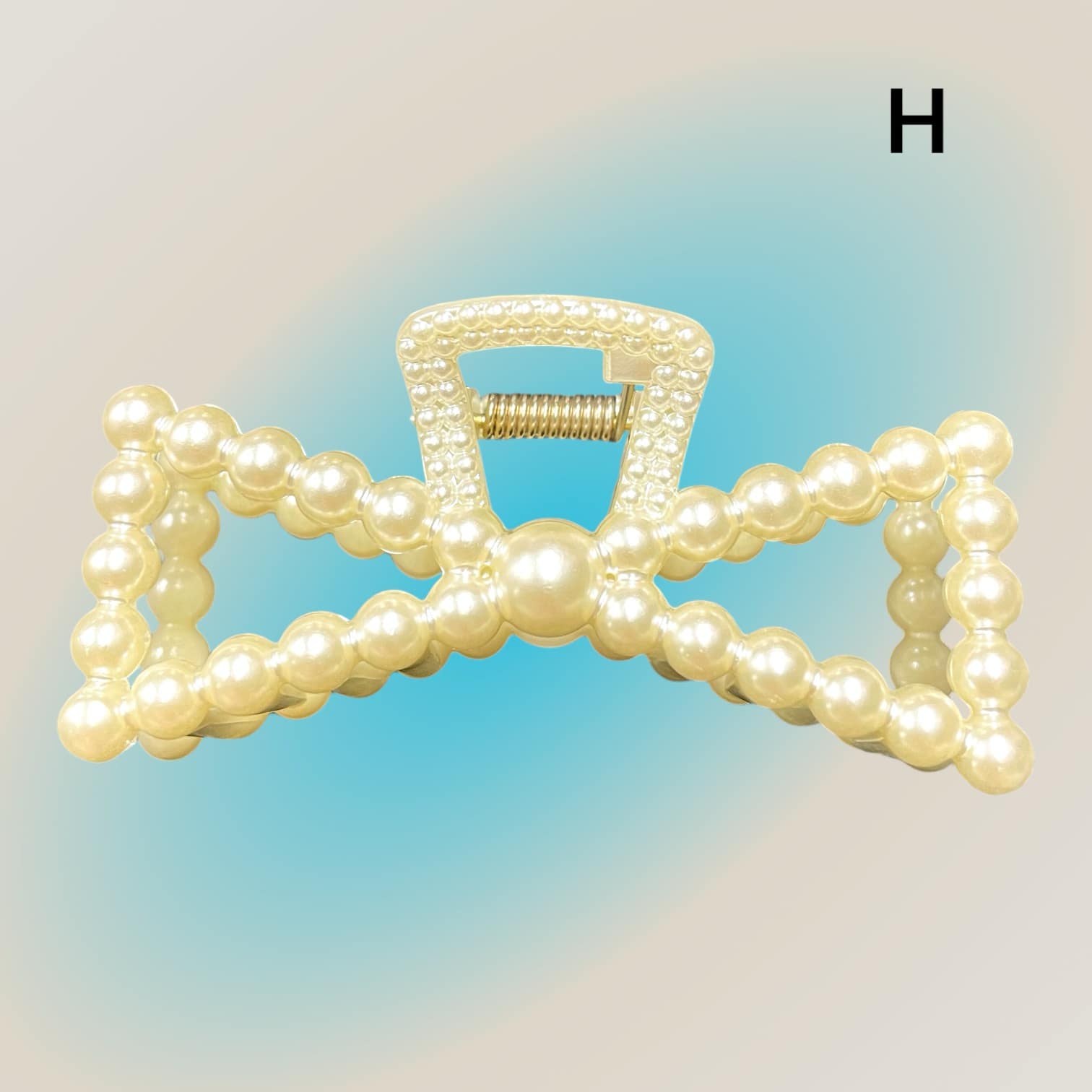 Pearl Perfection hair clip with imitation pearl embellishments for elegant hairstyles.