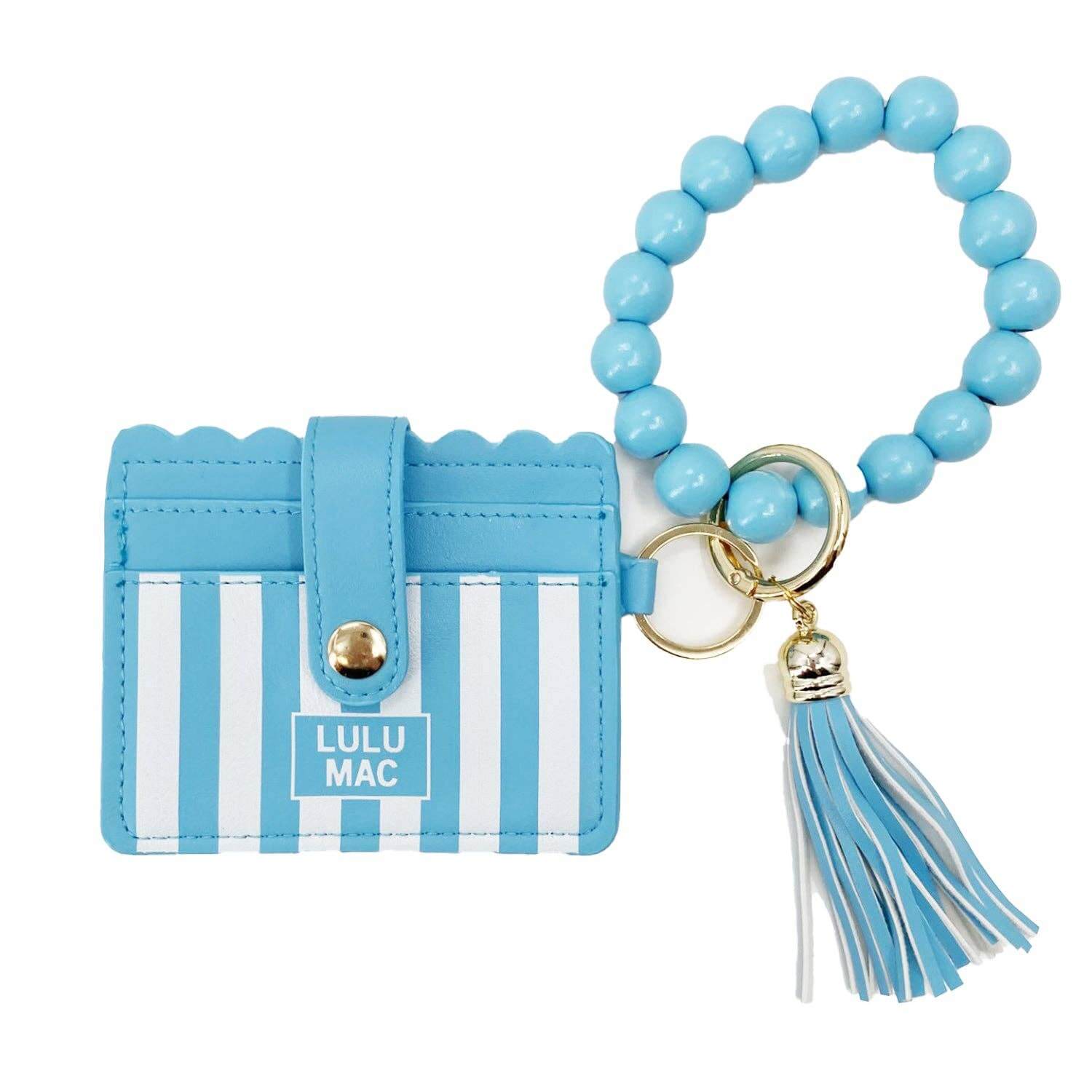 LULU MAC BLUE/WHITE WRISTLET featuring a vibrant stripe design and beaded wrist strap, perfect for on-the-go convenience.