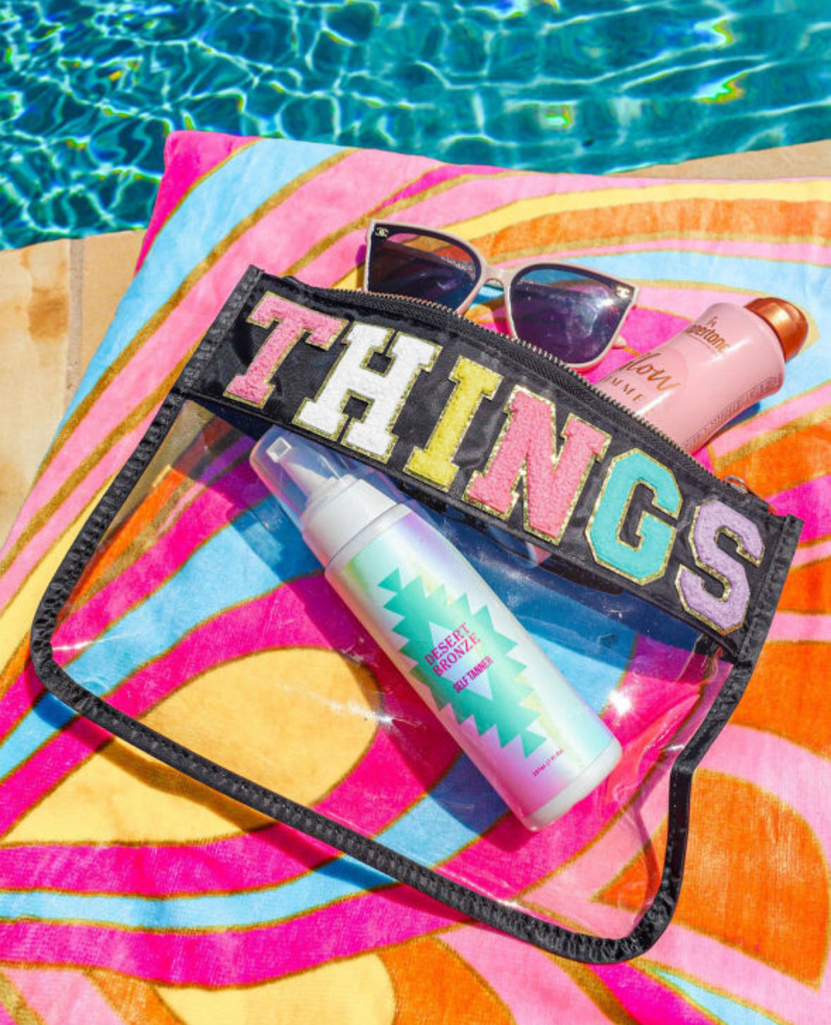 THINGS CASE by Teal Tiger Boutique $15.00 Introducing the THINGS CASE a stylish and practical accessory for all your travel needs. This super cute bag is trimmed in black and features a “Things” Chennille patch, making it the perfect companion for all of