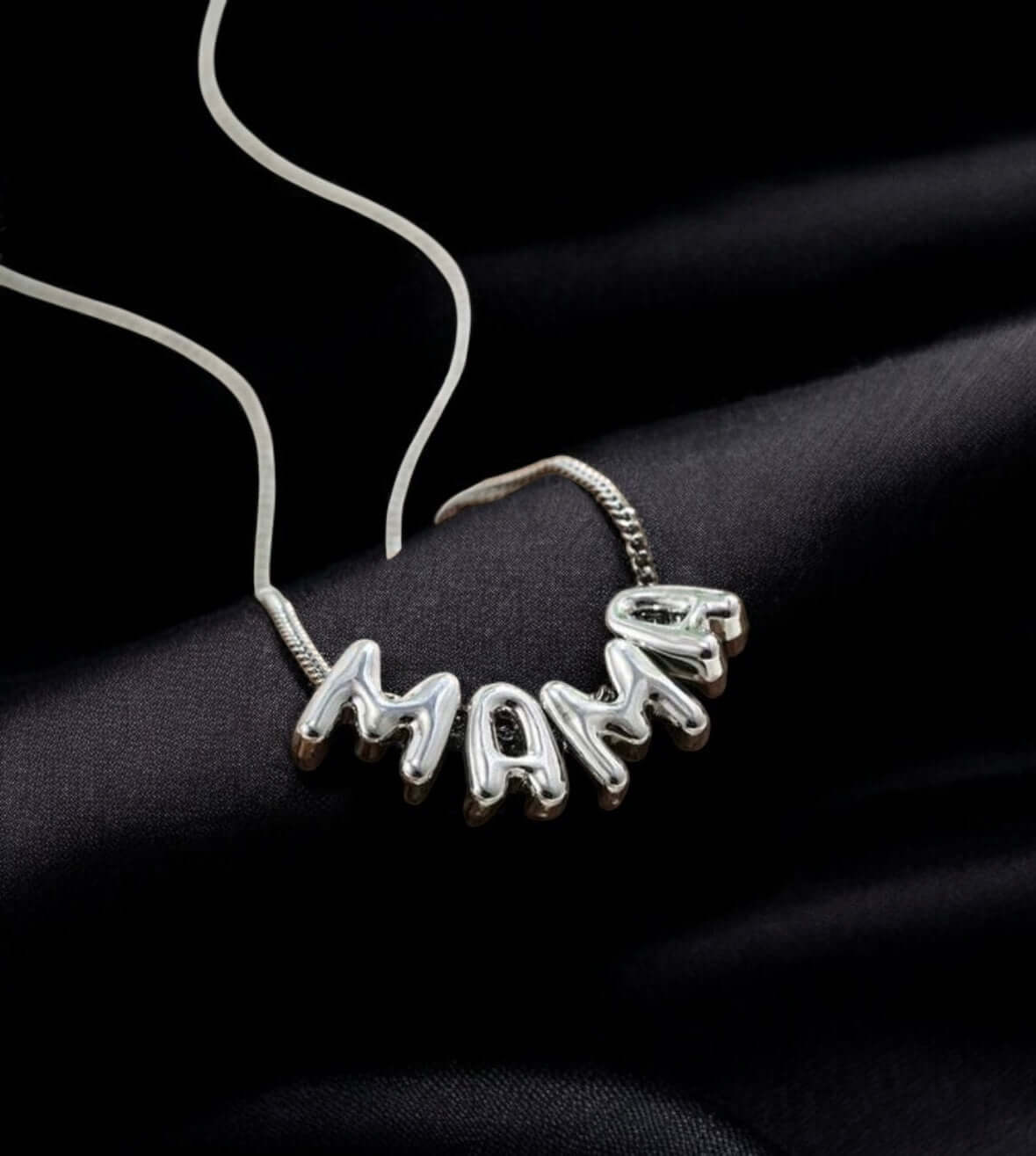 Bubbly Mama Necklace in silver tone featuring playful 'MAMA' charm on a sleek chain.