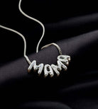 Bubbly Mama Necklace in silver tone featuring playful 'MAMA' charm on a sleek chain.