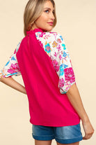 Back view of the Petal Passion Top featuring a floral design and vibrant pink fabric, ideal for stylish, casual outings.