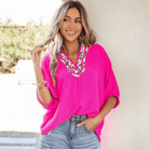 FIERCE FOCUS TOP (pink) featuring bold leopard patchwork trim and flattering V-neckline.