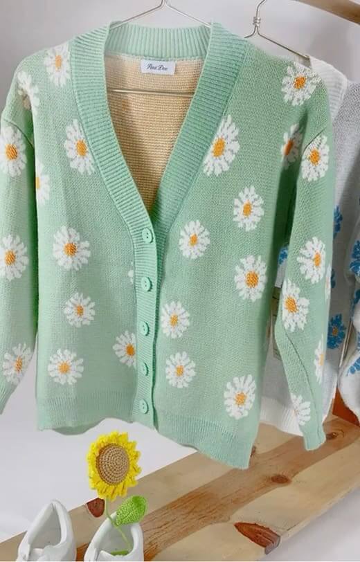 Teal Daisy Dreamer Cardigan with White Daisies and Button Front on Display