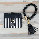 LULU MAC BLACK/WHITE WRISTLET showcasing a stylish ID wallet with a black beaded wristlet and tassel.