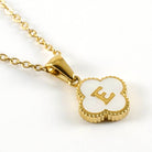MONOGRAM MOMENTS NECKLACE with gold pendant featuring the letter E on a delicate chain.