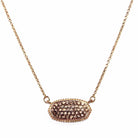 Elegant oval druzy pendant necklace with natural sparkle on gold chain, perfect for adding sophistication to any look.