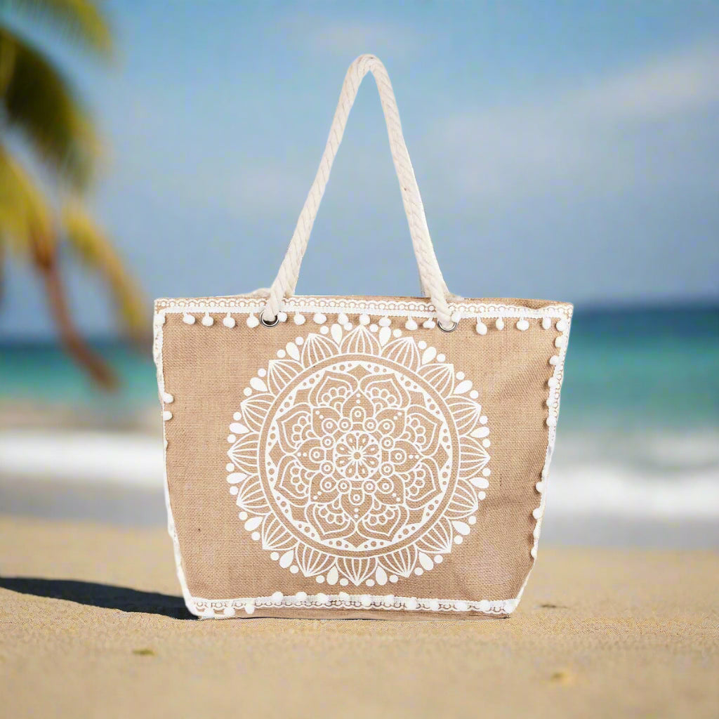 Boho floral tote bag with mandala design, cream tassels, and sturdy rope handles, made of 100% polyester.