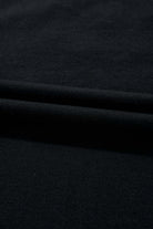 Close-up of soft black fabric showcasing a lightweight cotton blend material, ideal for stylish clothing.