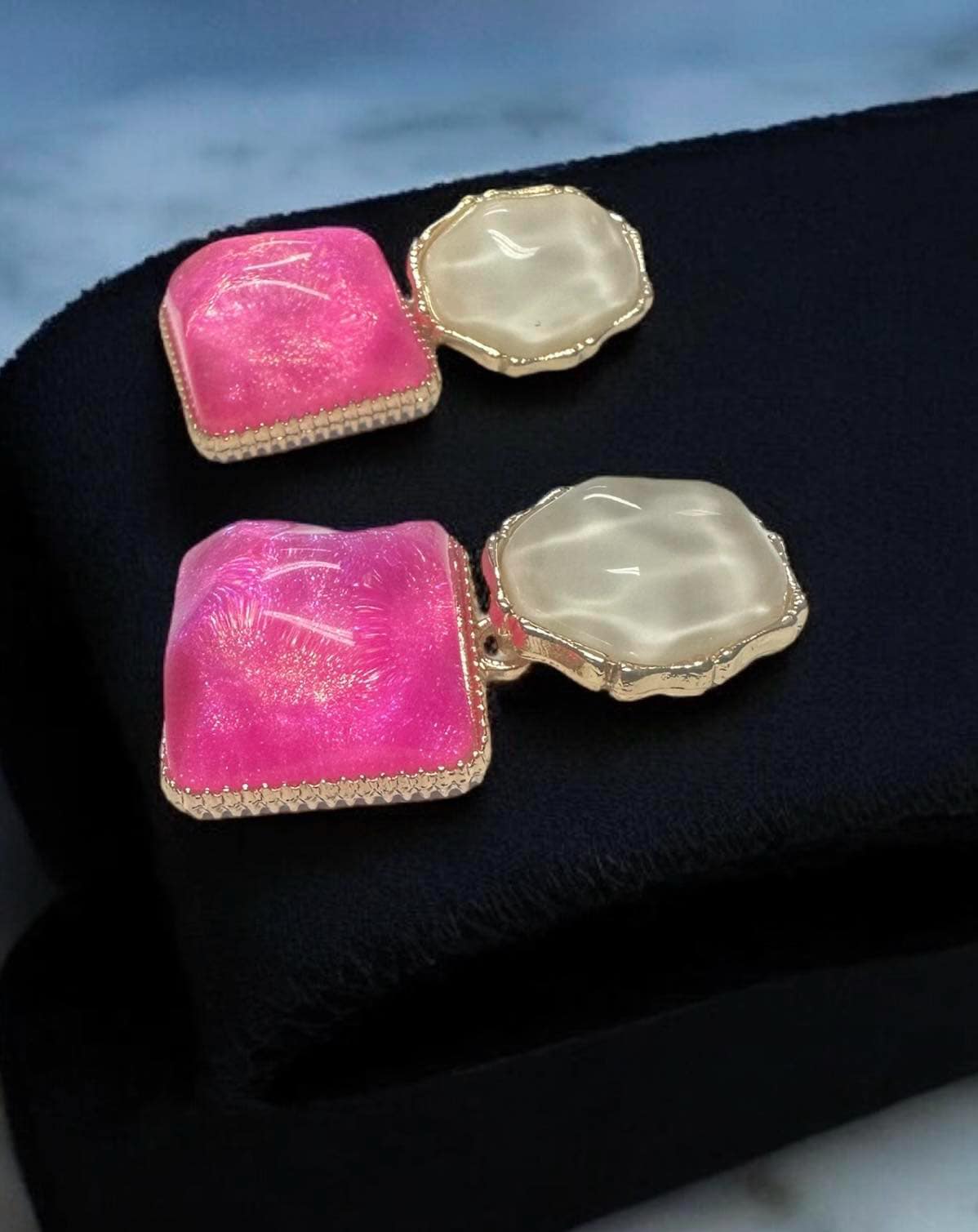 Glazed Gem Tone Earrings featuring pink and white gemstones set in a gold-toned frame, perfect for modern glam.