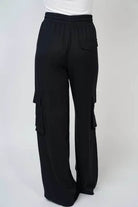 Black cotton cargo pants by White Birch with drawstring waist and multiple pockets, perfect for comfort and style.