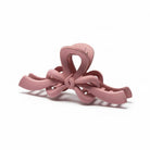 RIBBON REVIVAL HAIR CLIP (7 colors) - Matte pink bow claw clip for stylish and functional hair styling.