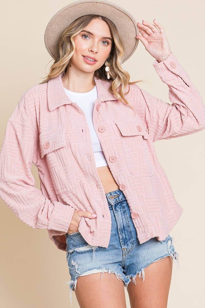 Pink women's embossed soft shacket with dolman sleeves, styled with denim shorts and a hat.