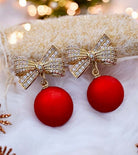 Festive earrings featuring a gold bow and red Christmas ball, perfect for holiday style and Christmas gatherings.