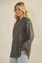ET7975-14 LONG SLEEVE V NECK ANIMAL URBAN RIB TOP modeled by a woman, showcasing its stylish animal print design.