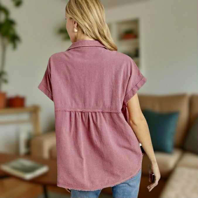 Back view of a woman wearing the Afternoon Glow Top by Umgee, showcasing its relaxed fit and soft fabric.