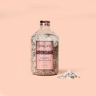 Petal-Infused Effervescent Mineral Bath Salts (Duo Pack) in a glass jar with lavender bath salts and a modern label.