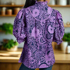 Back view of the Dreamland Top in purple and navy with floral print and ruffled sleeves, perfect for chic outfits.