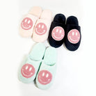 Smiley face indoor slide slippers in pink, aqua, and black for women, perfect for cozy home wear.