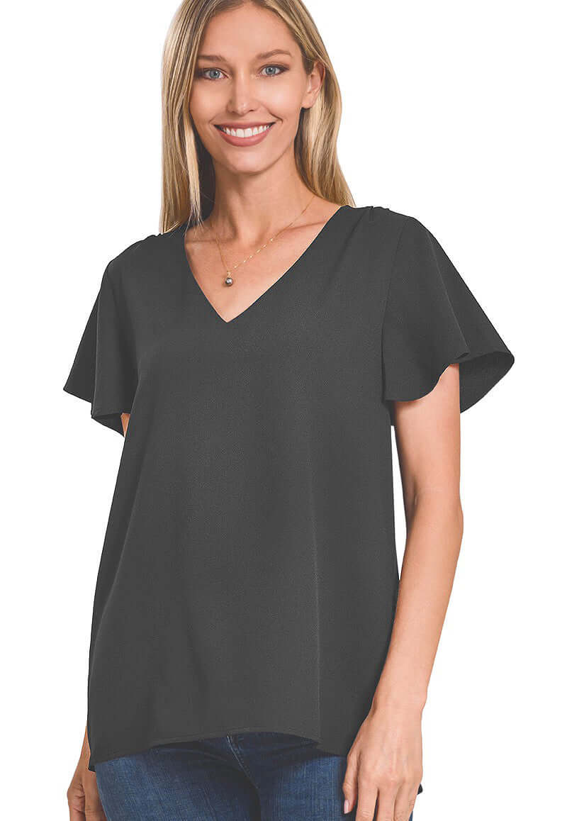 WAVE OF ENTHUSIASM TOP 2.0 in charcoal, featuring flutter sleeves and a stylish v-neck for a chic look.