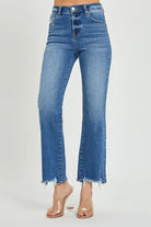 High rise relaxed straight Nora Jeans by Risen in medium dark wash with frayed hem, featuring stretch for comfort.