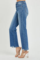 High rise relaxed straight fit Nora Jeans by Risen, medium dark wash with a frayed hem and plenty of stretch for comfort.