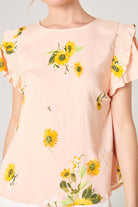 DAISY MARIE TOP by SugarLips in blush yellow with sunflower print and ruffle detail. Perfect for spring fashion.